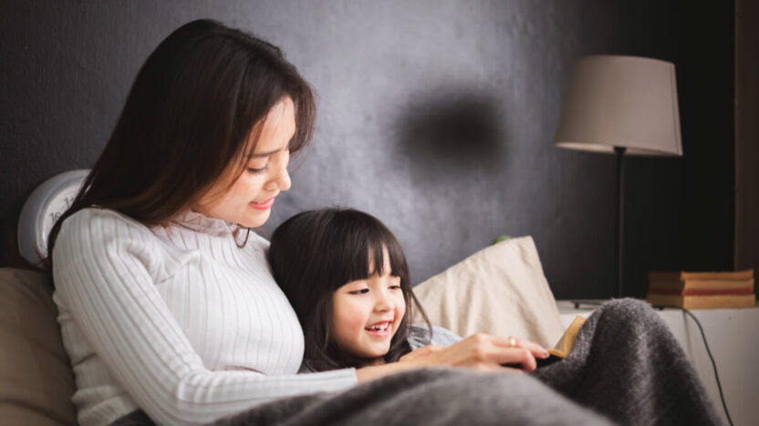 Vaikams, kuriems skaitoma prieš miegą, vystosi kitaip – štai kaip tai keičia jų smegenis